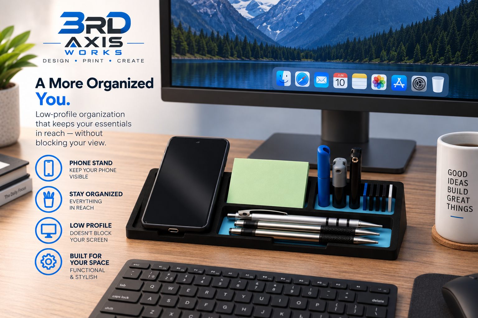 Low-profile black desk organizer holding a phone, sticky notes, pens, flash drives, and SD cards below a monitor